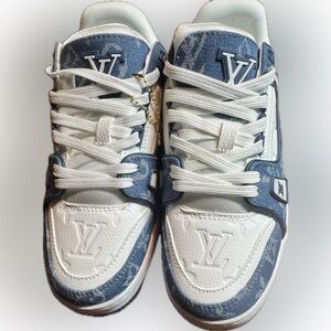 Brand new men’s low-top sneakers in a clean white and blue colorway.